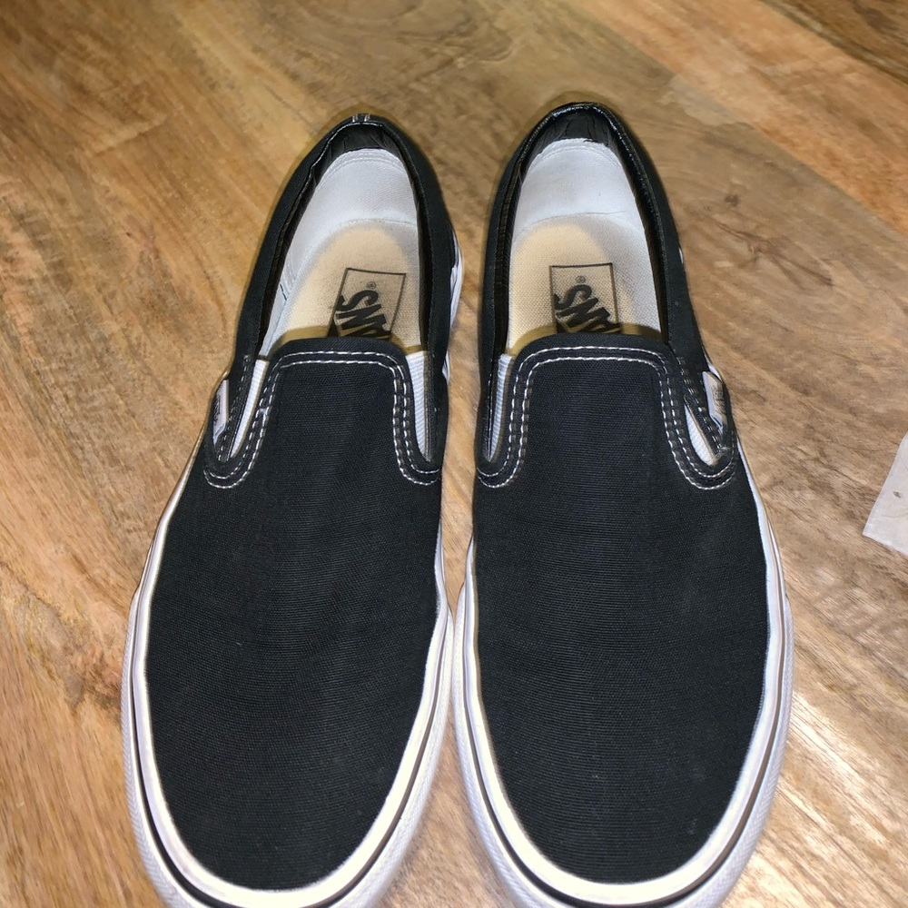 Black and white slip on vans